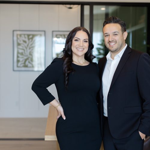 Sherman Oaks real estate team standing in front of residential interior.